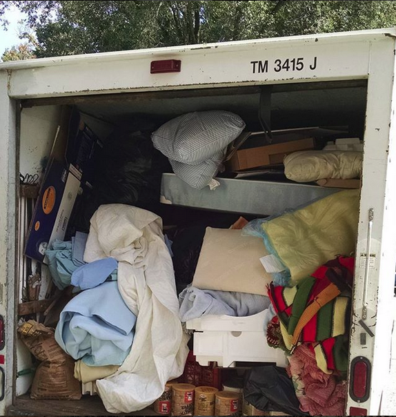 A truck full of trash after a property cleanout